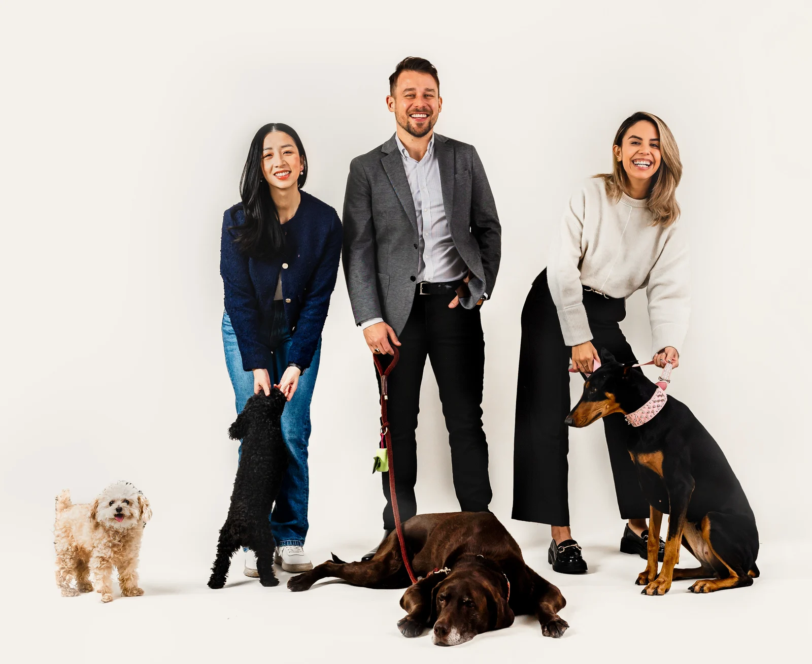 Jenny Bui, Pawel Parafianowicz and Valerie Capiral of Coral Realty Group with their dogs